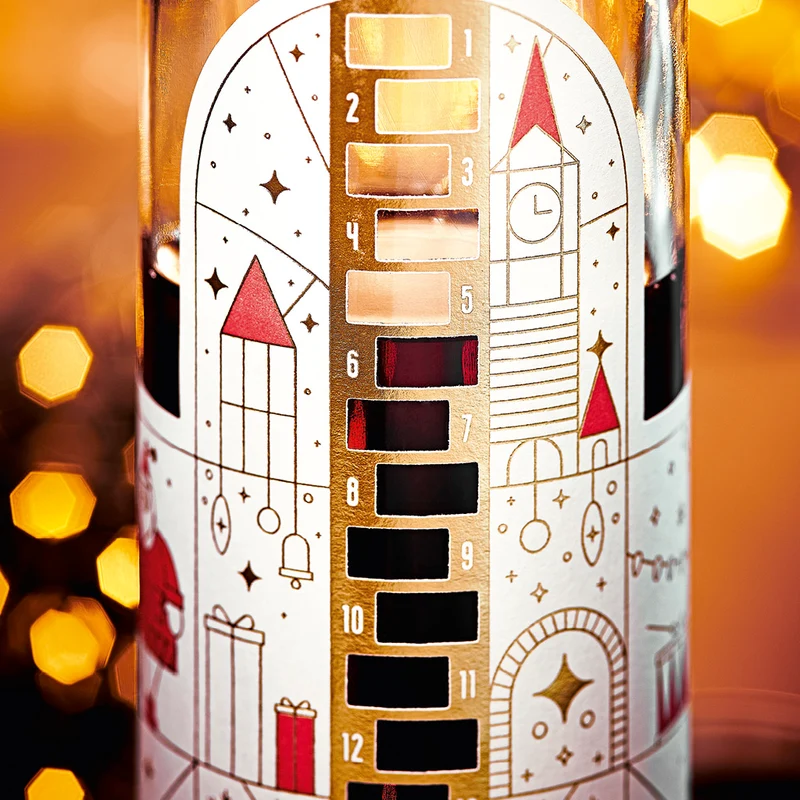 Wajos Adventskalender Flasche - gefüllt mit Gewürzpflaumen Likör